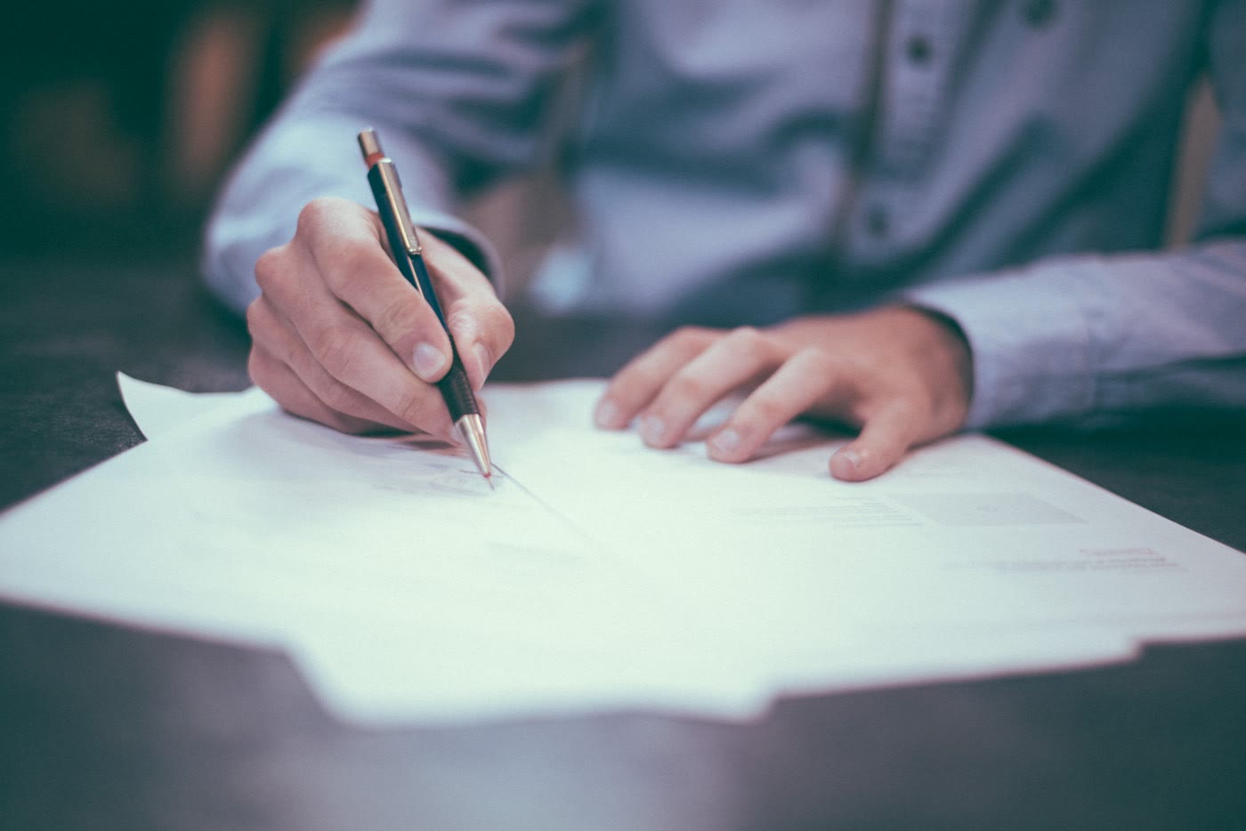 Professional reviewing regulatory and compliance documents